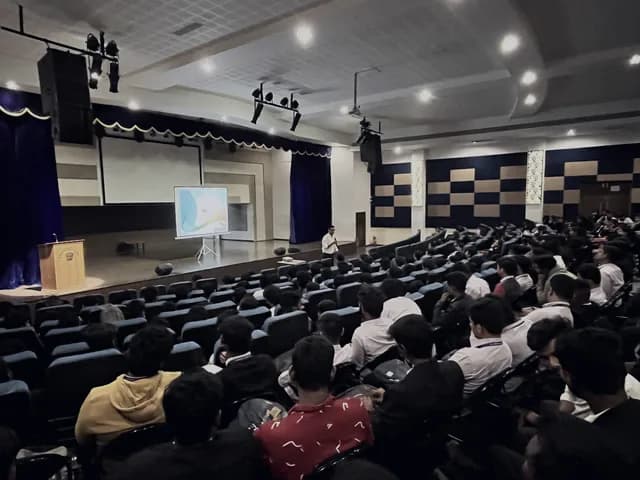 A full college auditorium during a financial literacy session