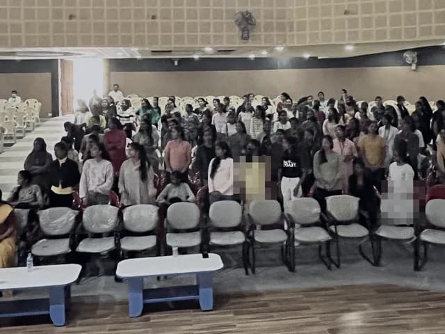 A hall of women attending a financial literacy session